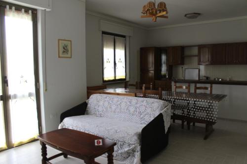 a living room with a couch and a table at L'Ortolano Apartments in Spoleto