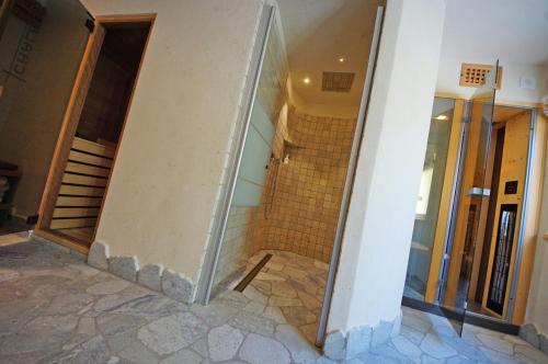 a hallway of a building with a staircase in a building at Pension Arnica B&B in San Vigilio Di Marebbe