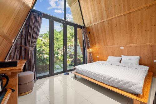 Ένα ή περισσότερα κρεβάτια σε δωμάτιο στο Aika Garden