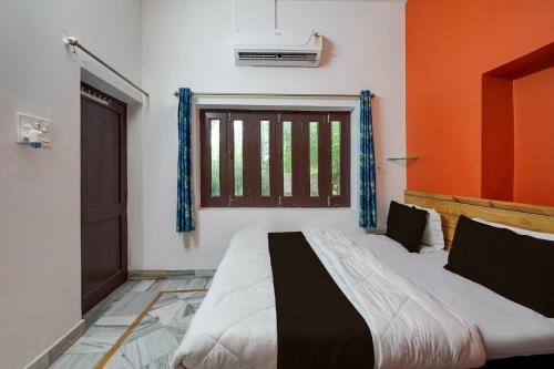 Postel nebo postele na pokoji v ubytování Super Hotel O Jodhpur Cantt Railway Junction Formerly Jannat Residency