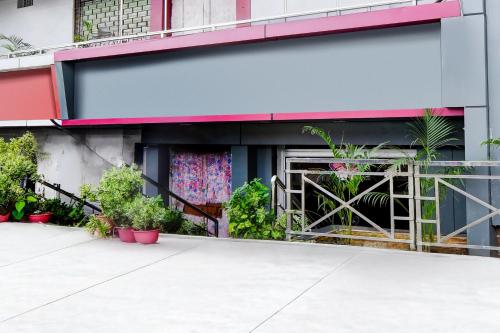 a building with plants in front of it at Super Collection O NIT More Adityapur Formerly Hotel Subheksha in Jamshedpur