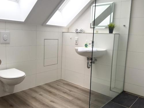 a bathroom with a sink and a toilet at See-Oase-Bad-Bederkesa in Bad Bederkesa