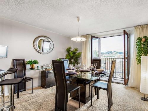 a dining room with a table and chairs and a window at 2 Bed in Polruan 75740 in Polruan
