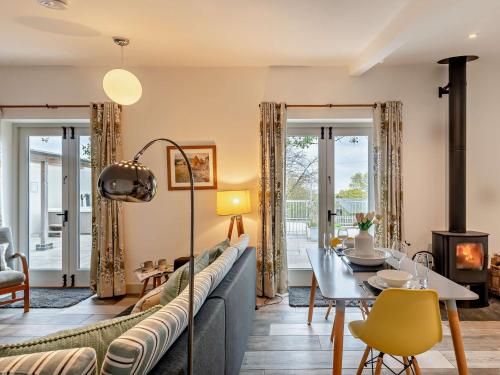 a living room with a couch and a table at 1 Bed in High Bickington 55322 in High Bickington