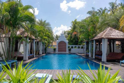 a pool at the resort at La Palm Garden - Luang prabang in Luang Prabang
