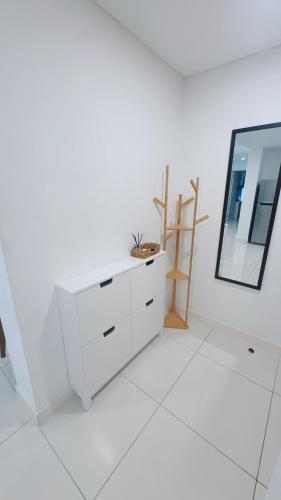 a white room with a mirror and a dresser at Horizon Condo 1BR in Choeng Mon Beach