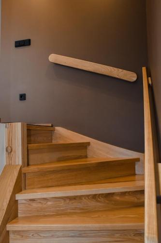 a set of wooden stairs in a house at Altstadt-Hotel in Freiberg