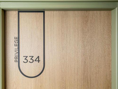 a close up of a wooden door with a number on it at Mercure Angoulême Hôtel de France in Angoulême