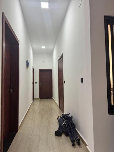 an empty hallway with an umbrella laying on the floor at Casa de Férias Chocas Mar in Mossuril