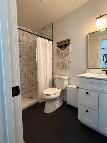 a bathroom with a toilet and a shower and a sink at Townhouse in Prime Location! in McCall