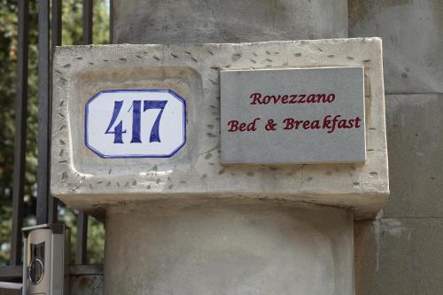 a sign on the side of a building that saysroxameronia bed and breakfast at Rovezzano B&B in Florence
