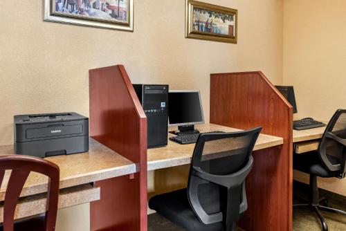 an office with two desks with computers and chairs at Baymont by Wyndham Yakima Riverfront in Yakima