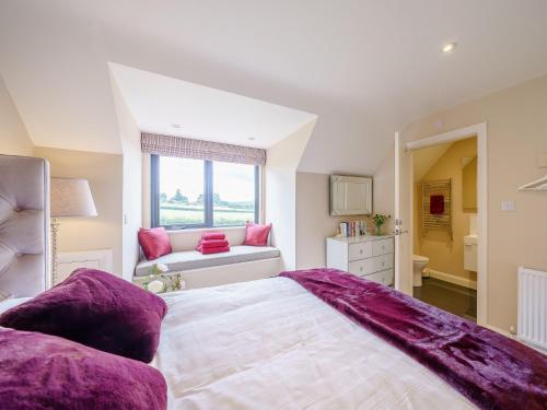 a bedroom with a large bed and a window at 5 Bed in Madley 78646 in Madley