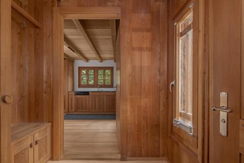 an open door to a room with wooden walls at Stall Ferienhaus in Münster