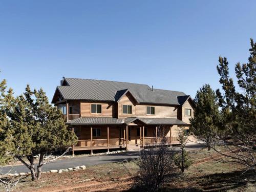 a log home with a black roof at Western Cabin Surrounded by Sublime Natural Beauty near Zion National Park in Utah in Springdale