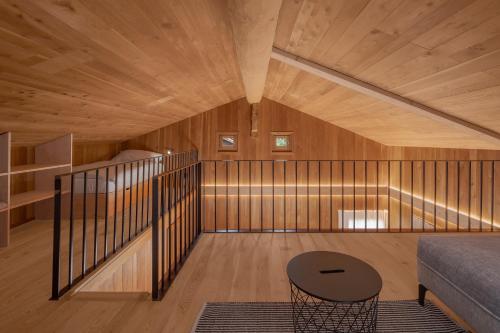 a room with wood paneling and a table and a couch at Stall Ferienhaus in Münster
