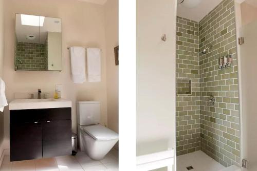 a bathroom with a toilet and a sink and a shower at Stunning and Secluded Lakeside Getaway in the Grass Valley of California in Pinecrest