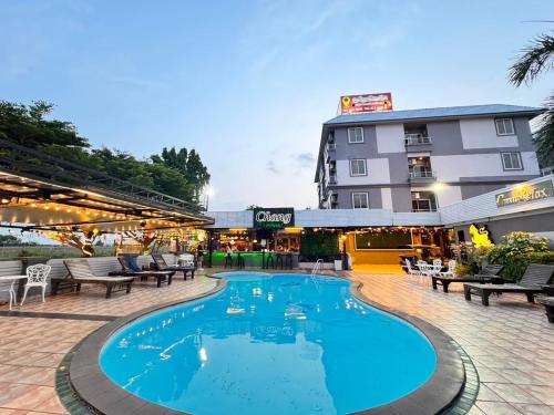 a pool in front of a hotel at The Great Residence Suvarnabhumi Airport in Lat Krabang