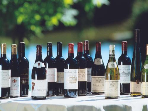 a bunch of bottles of wine on a table at Mercure Port La Grande Motte in La Grande-Motte
