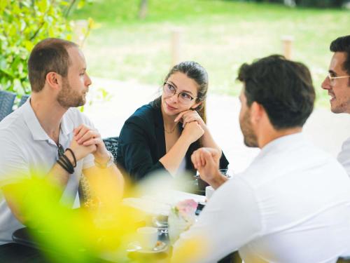 a group of people sitting around a table at Mercure Metz Centre in Metz