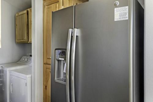 a stainless steel refrigerator in a kitchen at Intimate Chic Cabin Suitable for Four with Private Deck in Texas in Emory