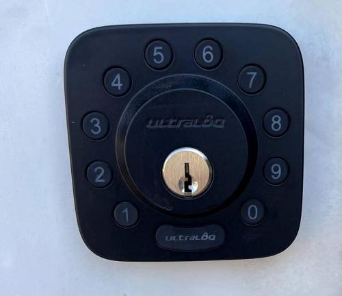 a black remote control attached to a wall at Intimate Chic Cabin Suitable for Four with Private Deck in Texas in Emory