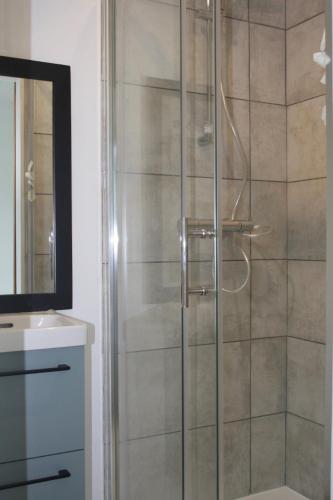 a shower with a glass door in a bathroom at TyGroaz studio in Porspoder in Porspoder