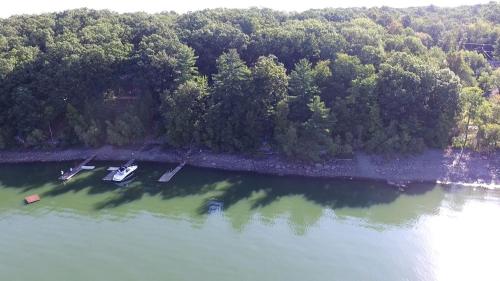 an aerial view of a lake with two boats in it at Lakefront Cabin Rental with Incredible Sunsets on Lake Wallenpaupack, Pennsylvania in Tafton