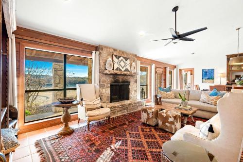 a living room with a couch and a fireplace at Impressive Modern Cabin with Beautiful Interior and Exterior in Ingram, Texas in Hunt