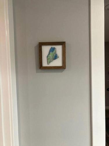 a picture on a white wall with a picture on it at Lake Cabin Ideal for Outdoor Adventures in Maine in North Harpswell