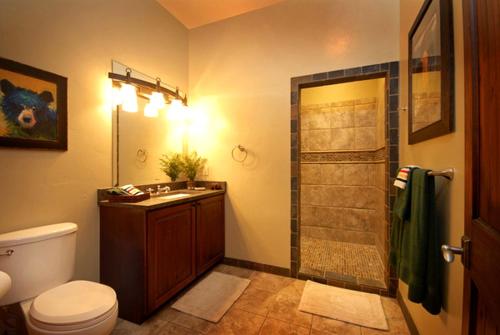 a bathroom with a toilet and a sink and a shower at Deluxe Vacation Suite with Private Bathroom in Melrose, Montana in Divide