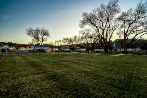 a large grass field with houses in the background at Pet-Friendly Airstream Stay Near Whiskey Row in Prescott AZ in Prescott