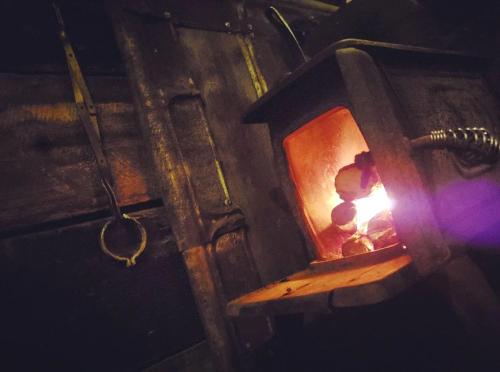 a child is sitting in a light in a box at Rustic Container Accommodation for Glamping in Kentucky in Owenton