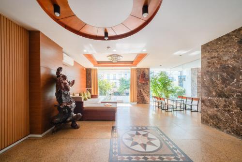 a living room with a large circular ceiling at Hola Nha Trang hotel in Nha Trang