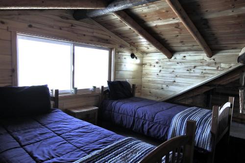 Postel nebo postele na pokoji v ubytování Gorgeous Wooden Rustic Cabin in Blanding, Utah