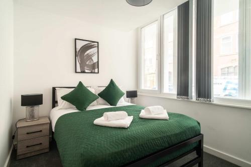 En eller flere senge i et værelse på Cosy 1 BED in Central Preston