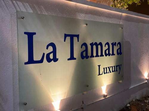 a sign for a la tamedana library at La Tamara Luxury - TIE Hotels & Resorts in Pondicherry