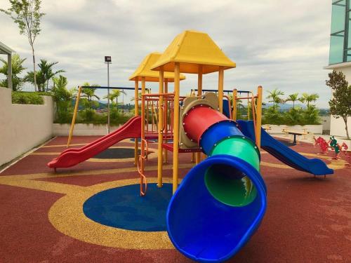 a playground with a slide and a swing at EVO Soho Bangi Netflix putrajaya early check-in in Bandar Baru Bangi
