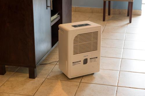 a heater sitting on the floor in a kitchen at Pumilio Mountain & Ocean Hotel in Jacó