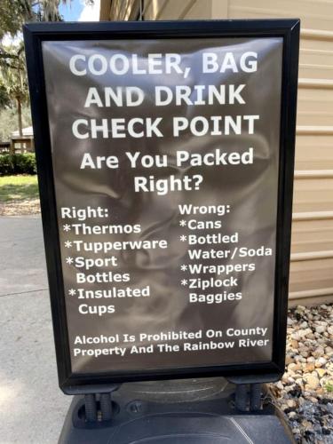 a sign that says cooler bag and drink check point at Charming Cottage Surrounded by Trees in Dunnellon, Florida in Dunnellon