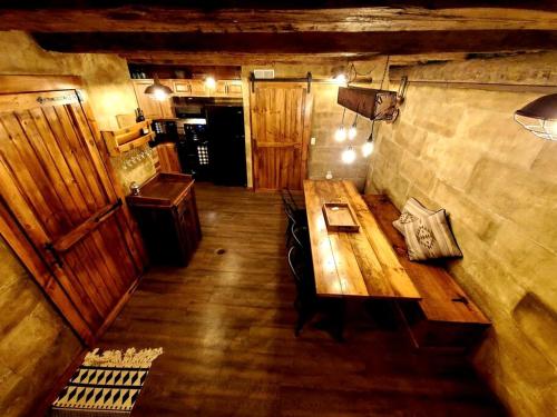 an overhead view of a room with a wooden table at Renovated Cottage with Spa Surrounded by Beautiful Hiking Trails in Ohio in Deersville