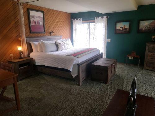 a bedroom with a large bed and a window at Spacious Bed and Breakfast Suite on Horse Farm for Unique Getaway in Oak Harbor, Washington in Maple Grove Beach