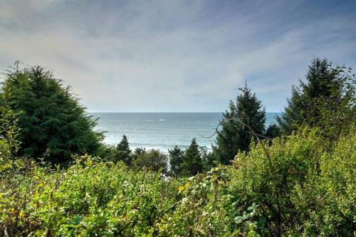 a view of the ocean from a hill with trees at Gorgeous A-Frame by the Beach in Otter Rock, Oregon in Otter Rock