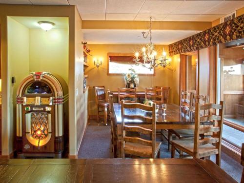 a dining room with a wooden table and chairs at Spacious Vacation Rental for Groups or Events with Sauna and Hot Tub in Athol, Idaho in Athol