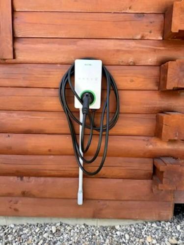 a wall with a electrical outlet attached to it at Stunning Cabin with Hot-tub, Fire Pit and Games in Stanton, Kentucky in Stanton