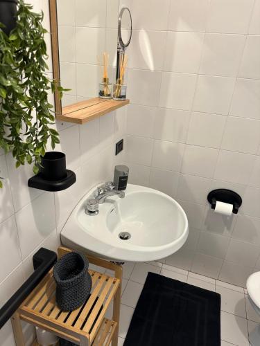 a bathroom with a sink and a mirror at La Cabine Noire - Foppolo - Offerta in quota in Foppolo