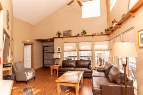a living room with a couch and a table at Luxury Cabin with ATV Trails near the Continental Divide in Colorado in Monarch