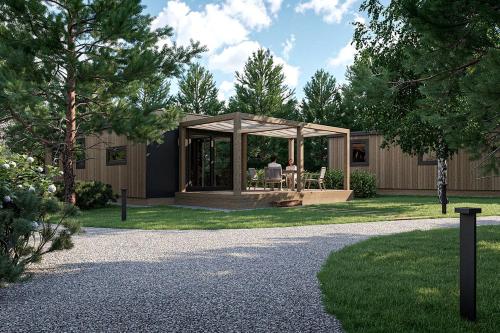 ein Haus mit einem Pavillon im Hof in der Unterkunft Dreamy Austria Resort with a Stunning Pool in Unterlibitsch