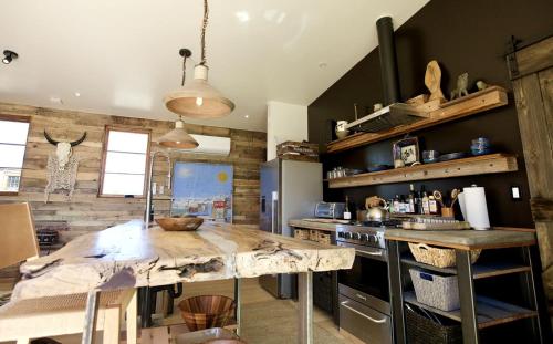 a kitchen with a wooden counter top in a room at Stunning Design Rental Incredible for a Luxury Escape in Lone Pine, California in Lone Pine