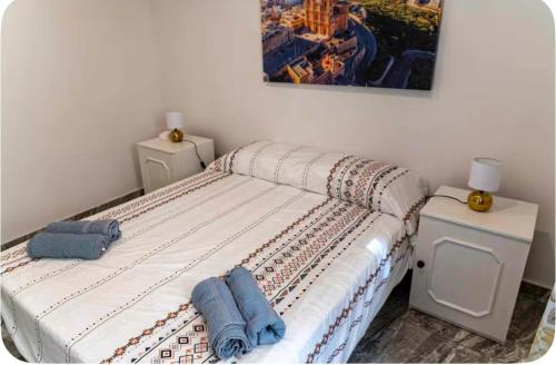 a bedroom with a bed with two towels on it at Stay by the Grand Harbour of Valletta in Senglea